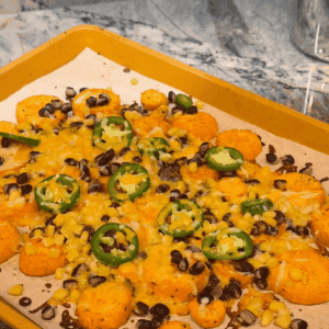 close up of sweet potato nachos on sheet pan