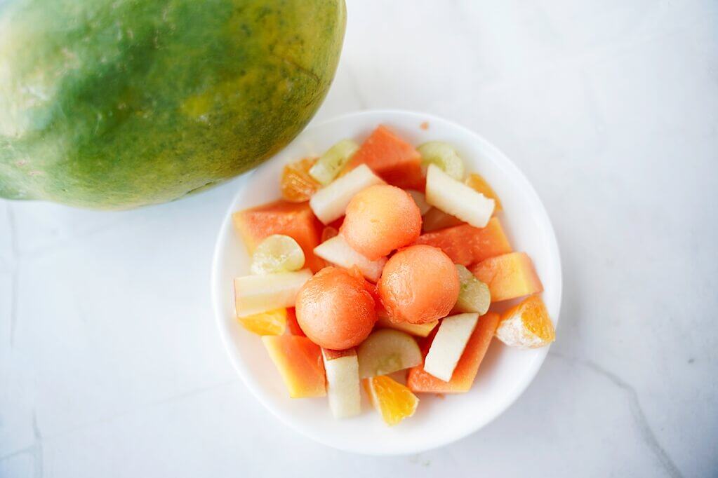 overhead view of a papaya fruit salad