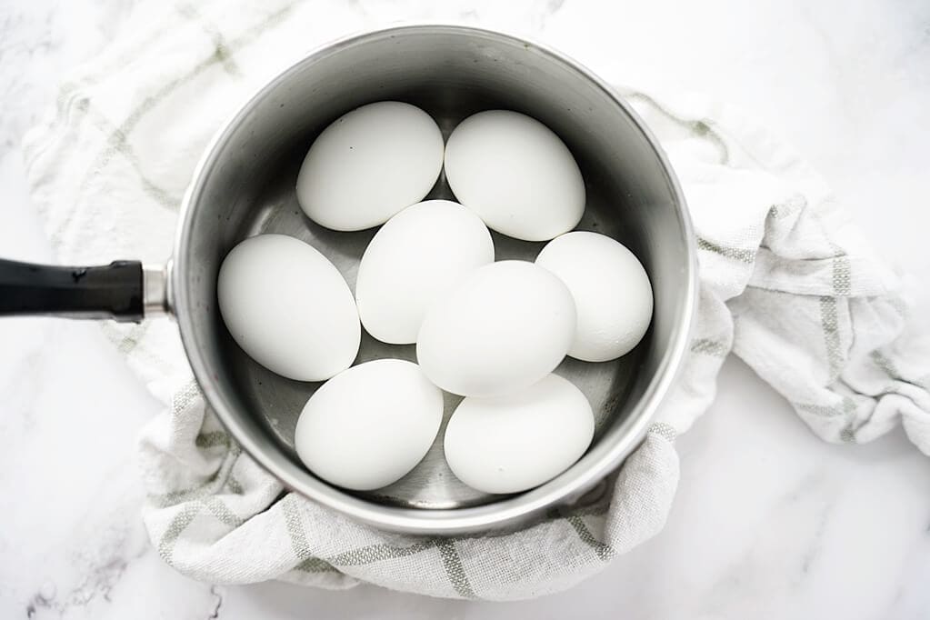 Pot of eggs on white kitchen counter