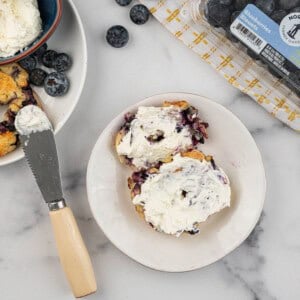 Blueberry bagel with cream cheese spread