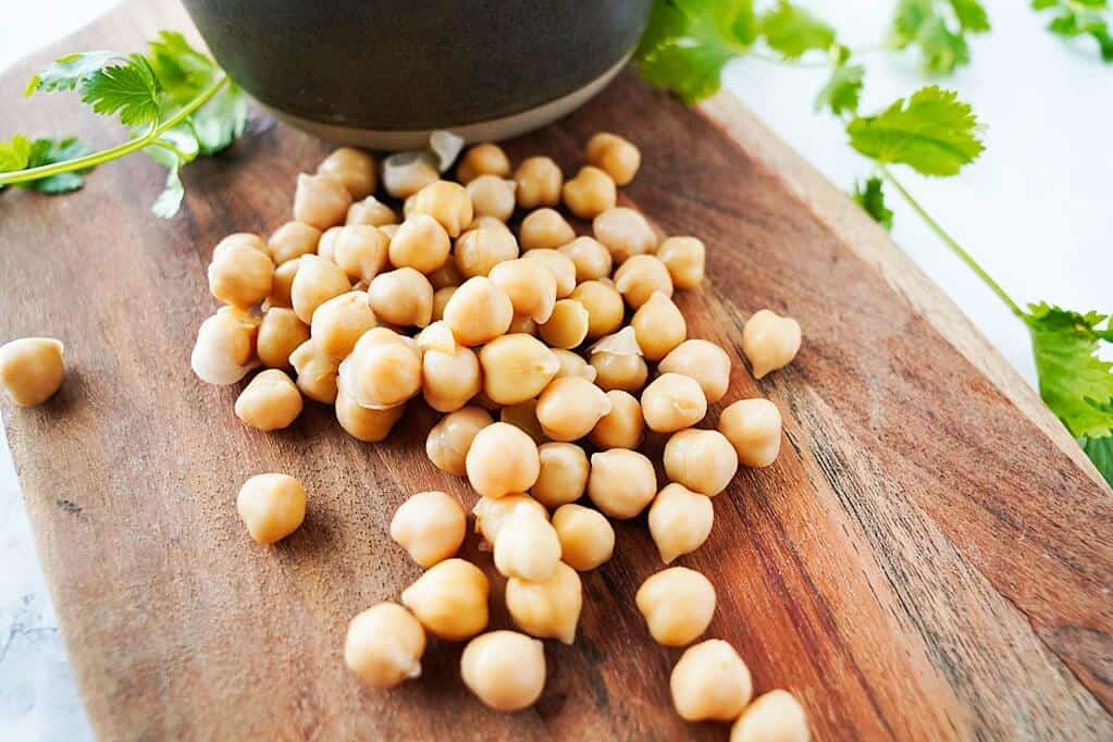 Chickpeas on wooden cutting board