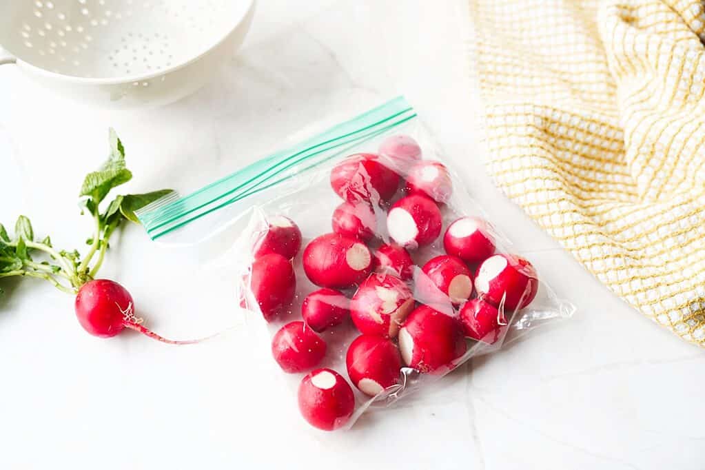 Whole radishes stored in plastic bag