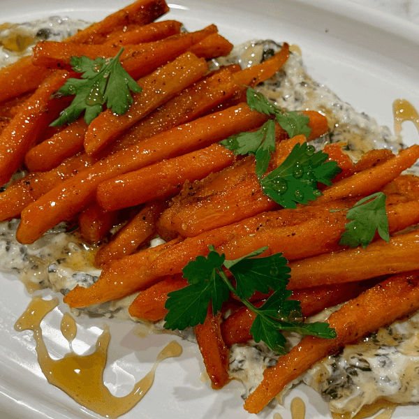 Crispy Carrot Fries on Whipped Feta with White plate