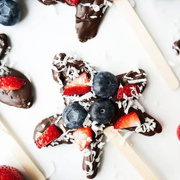 Homemade Chocolate Stars on white background with strawberries