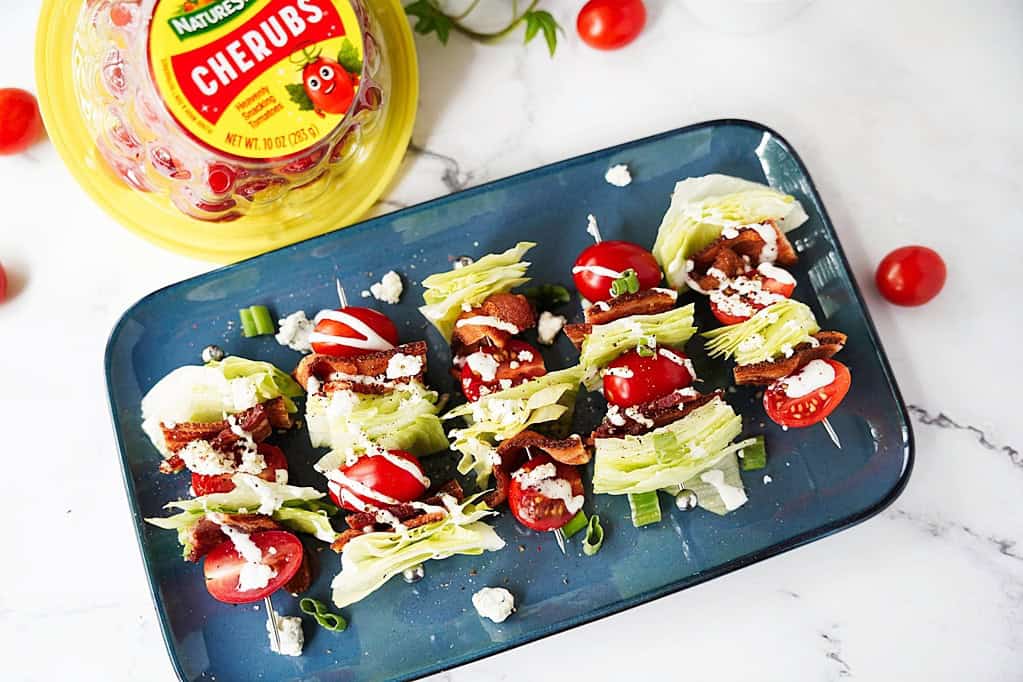 wedge salad on stick on a blue serving platter
