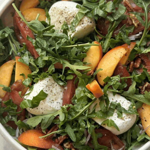 overhead shot of the peach burrata salad
