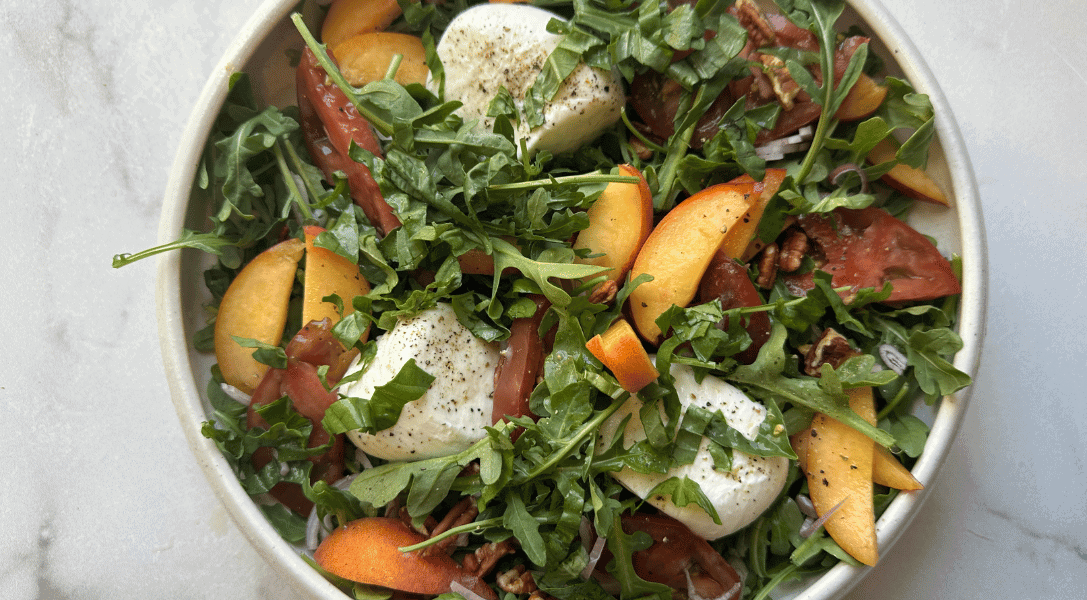 overhead shot of the peach burrata salad