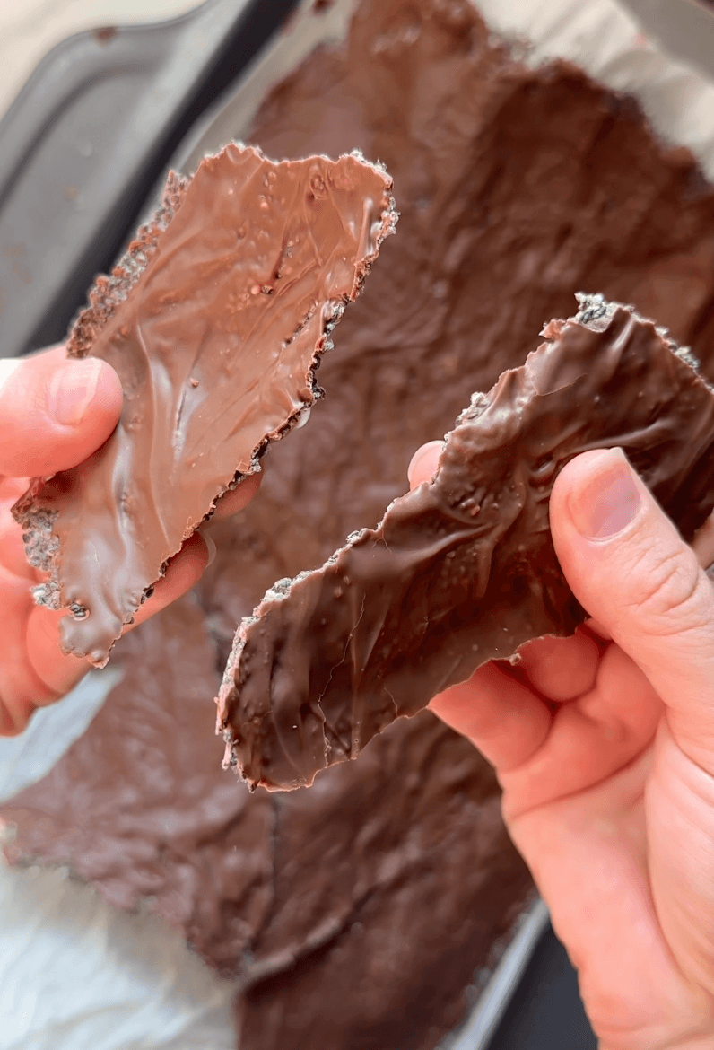 close up of breaking the chia seed chocolate crackers